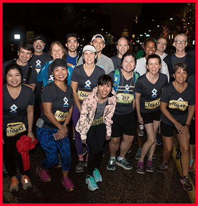 Group photo of runners standing together