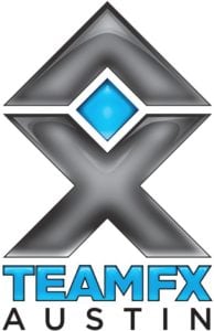 Un logotipo para el grupo de corredores TEAM FX. El logotipo incluye una X estilizada sobre las palabras &quot;TEAM FX&quot;. La X es negra y las palabras &quot;TEAM FX&quot; son azules.