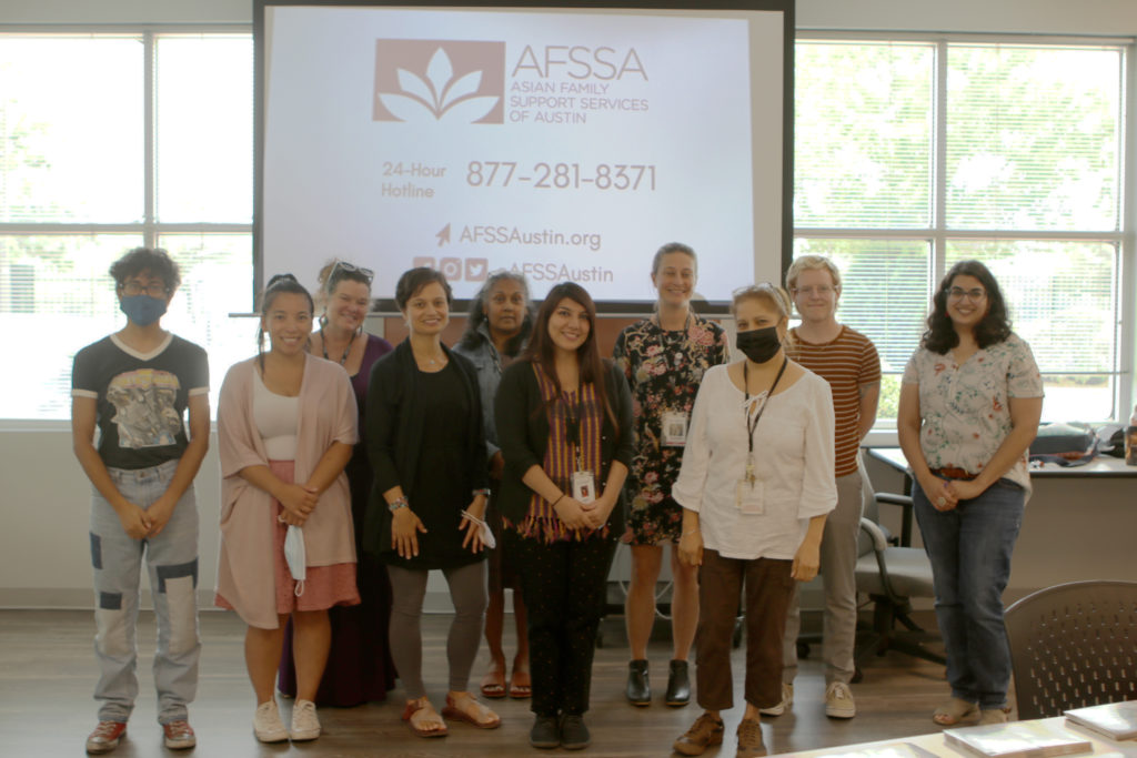 Image description: A photo of SAFE and AFSSA staff during SAFE's Asian, Pacific Islander, and Pan Asian potluck.