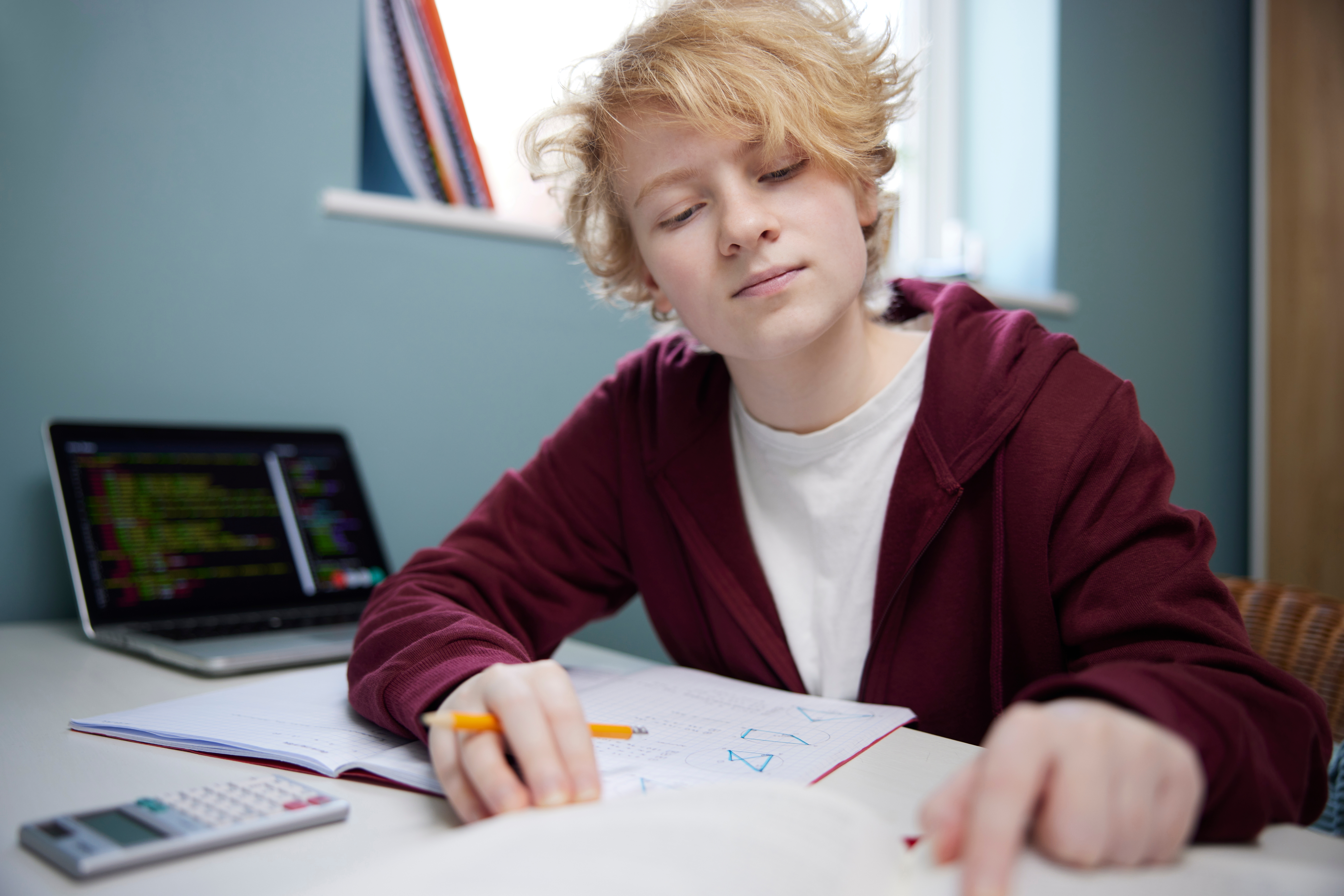 nonbinary teen doing homework