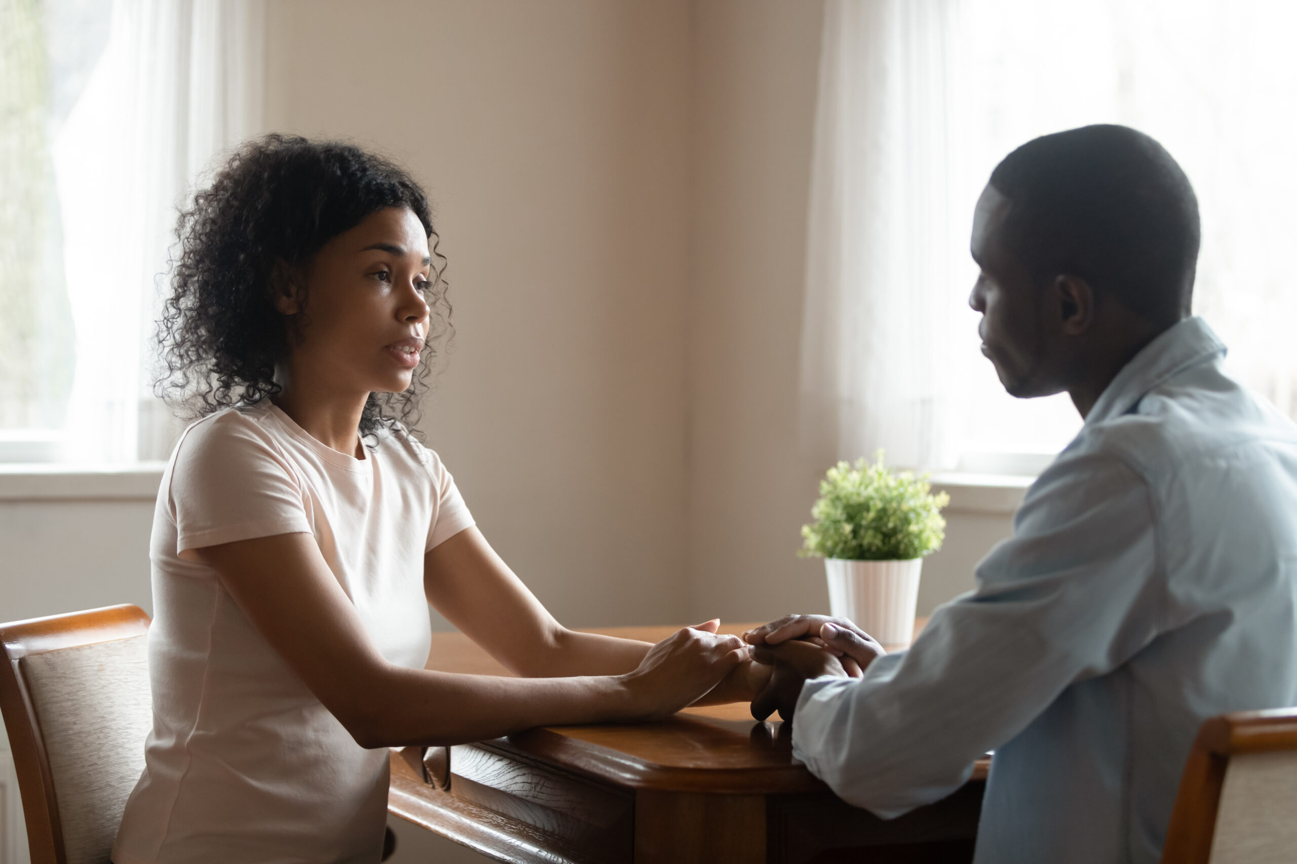 Woman supporting male friend